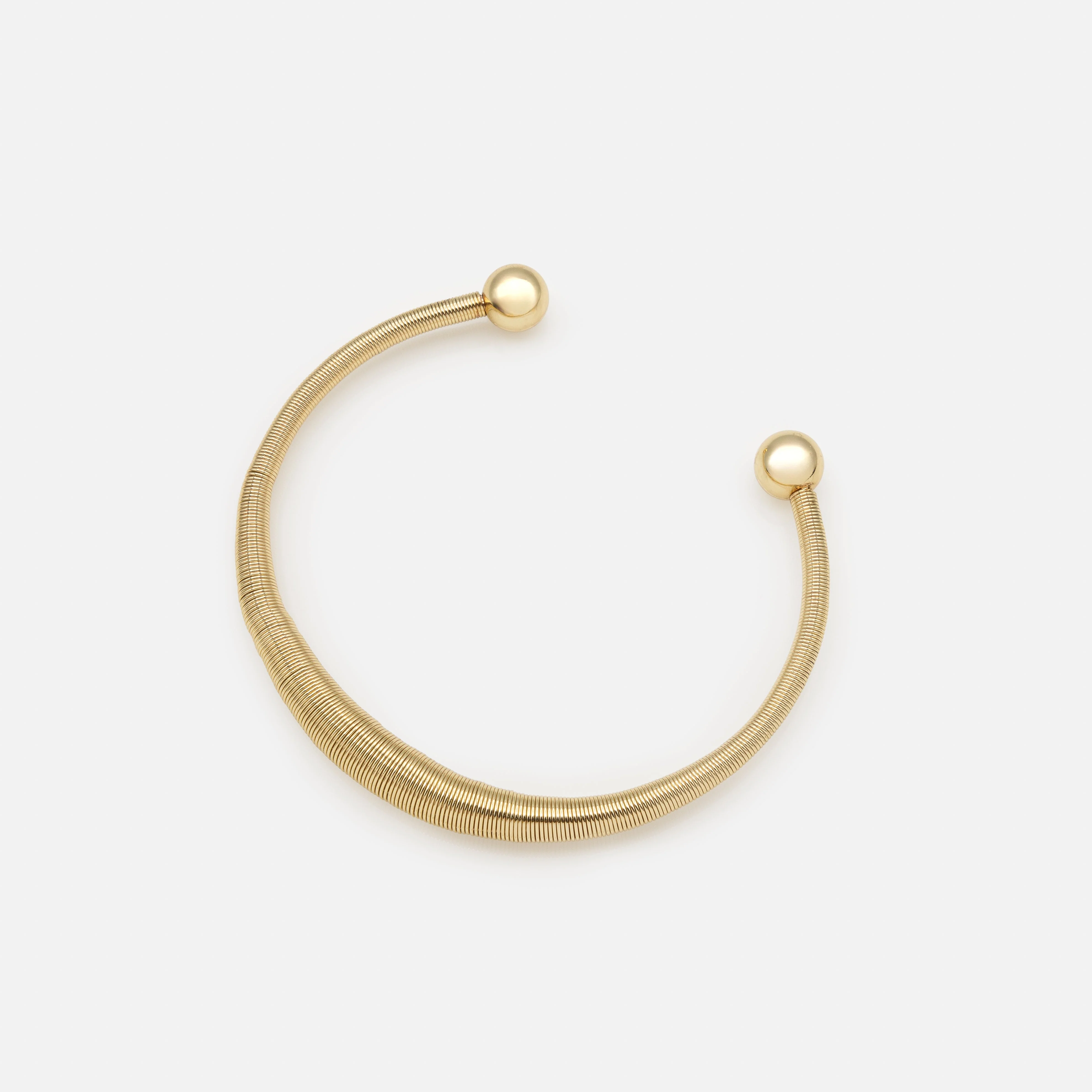 Bracelet rigide doré effet ressort