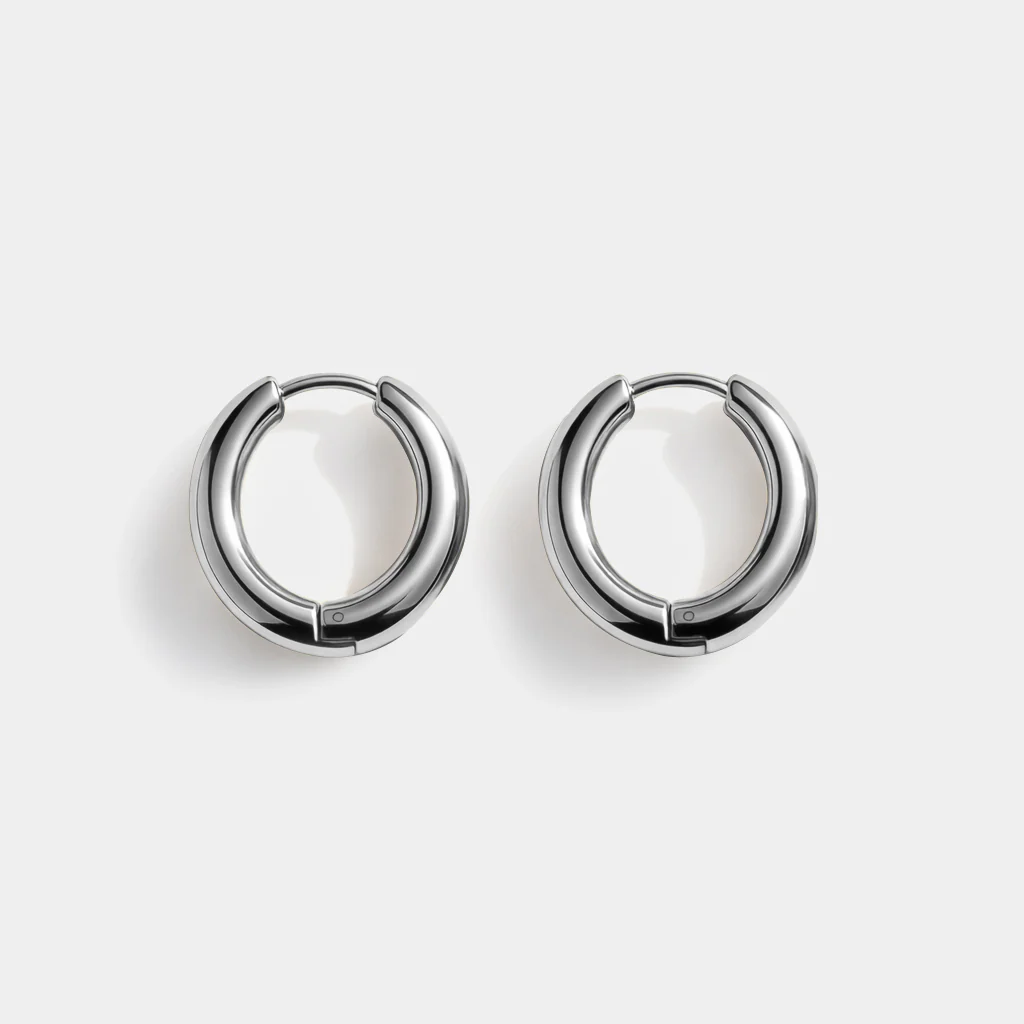 Boucles d'oreilles huggies argentées en acier inoxydable - Essence