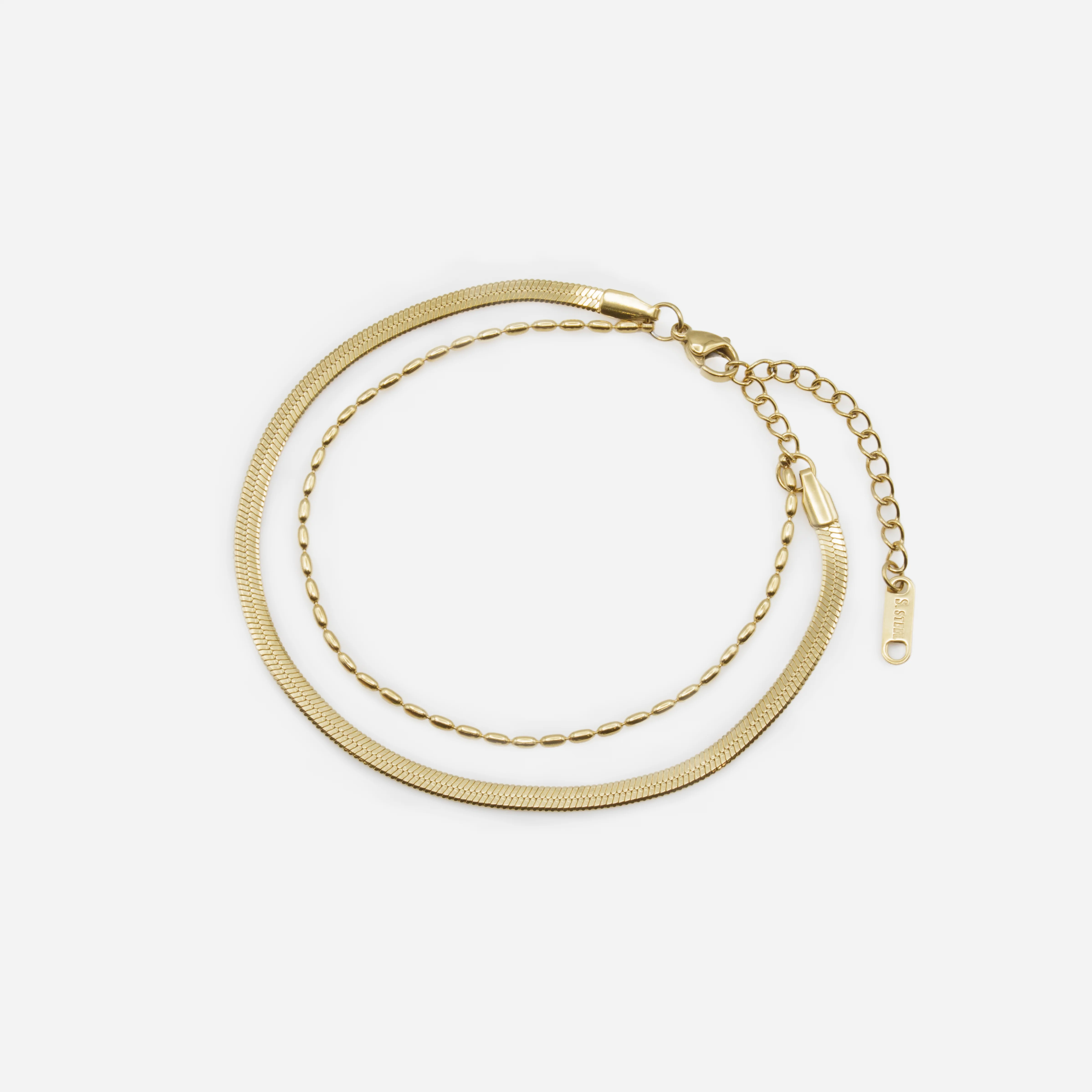 Bracelet doré double chaîne à mailles plates et billes allongées en acier inoxydable