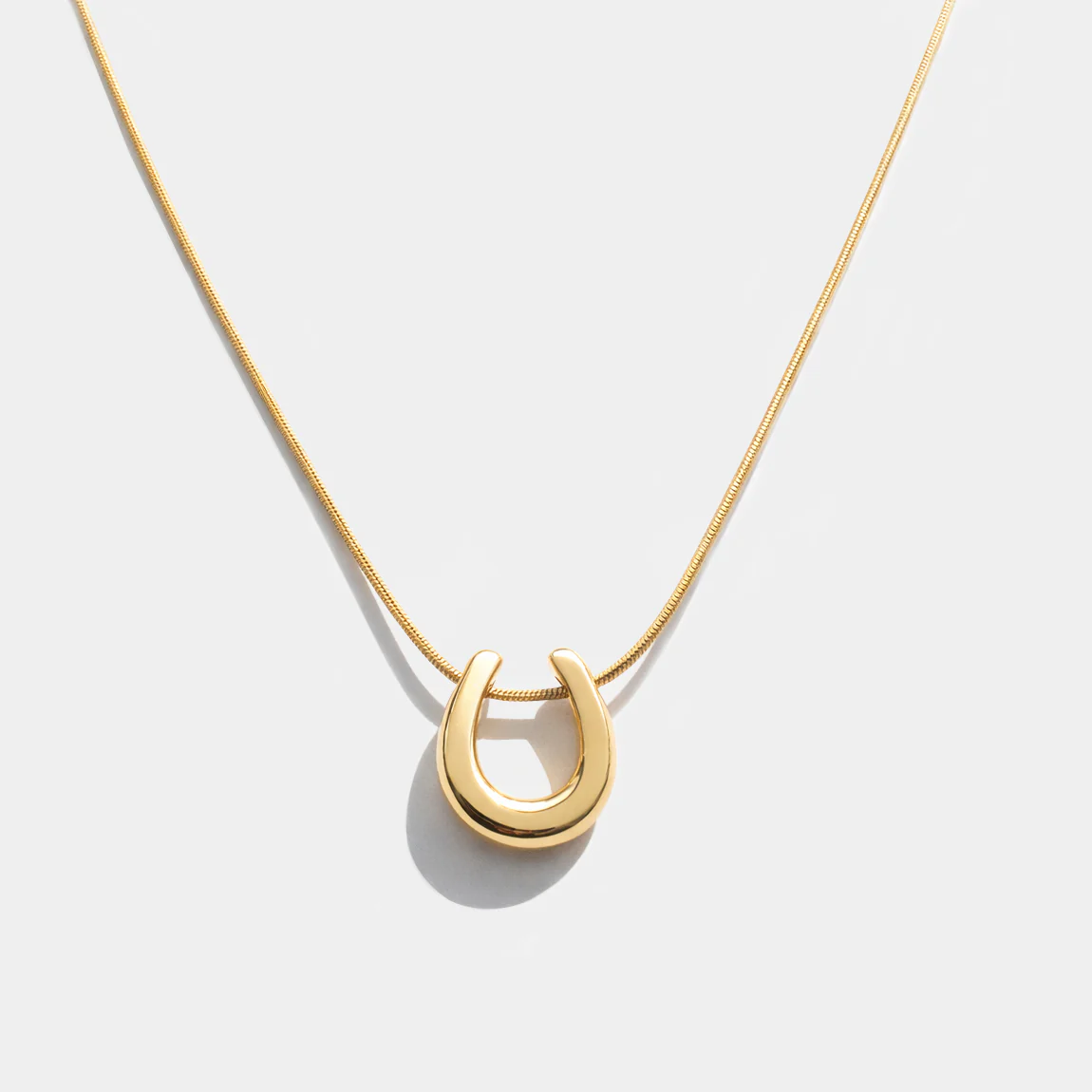 Collier doré breloque fer à cheval en acier inoxydable