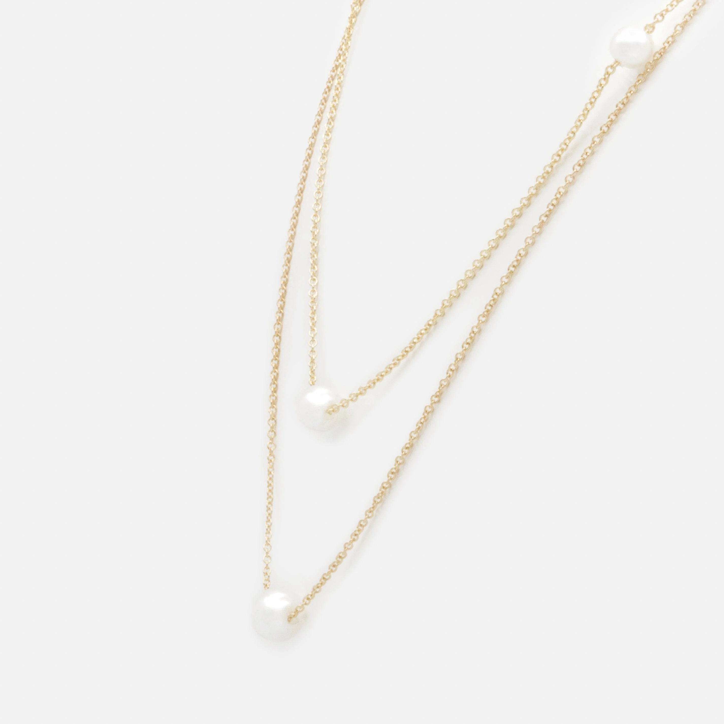 Collier doré double chaîne avec perles rondes - Image 2
