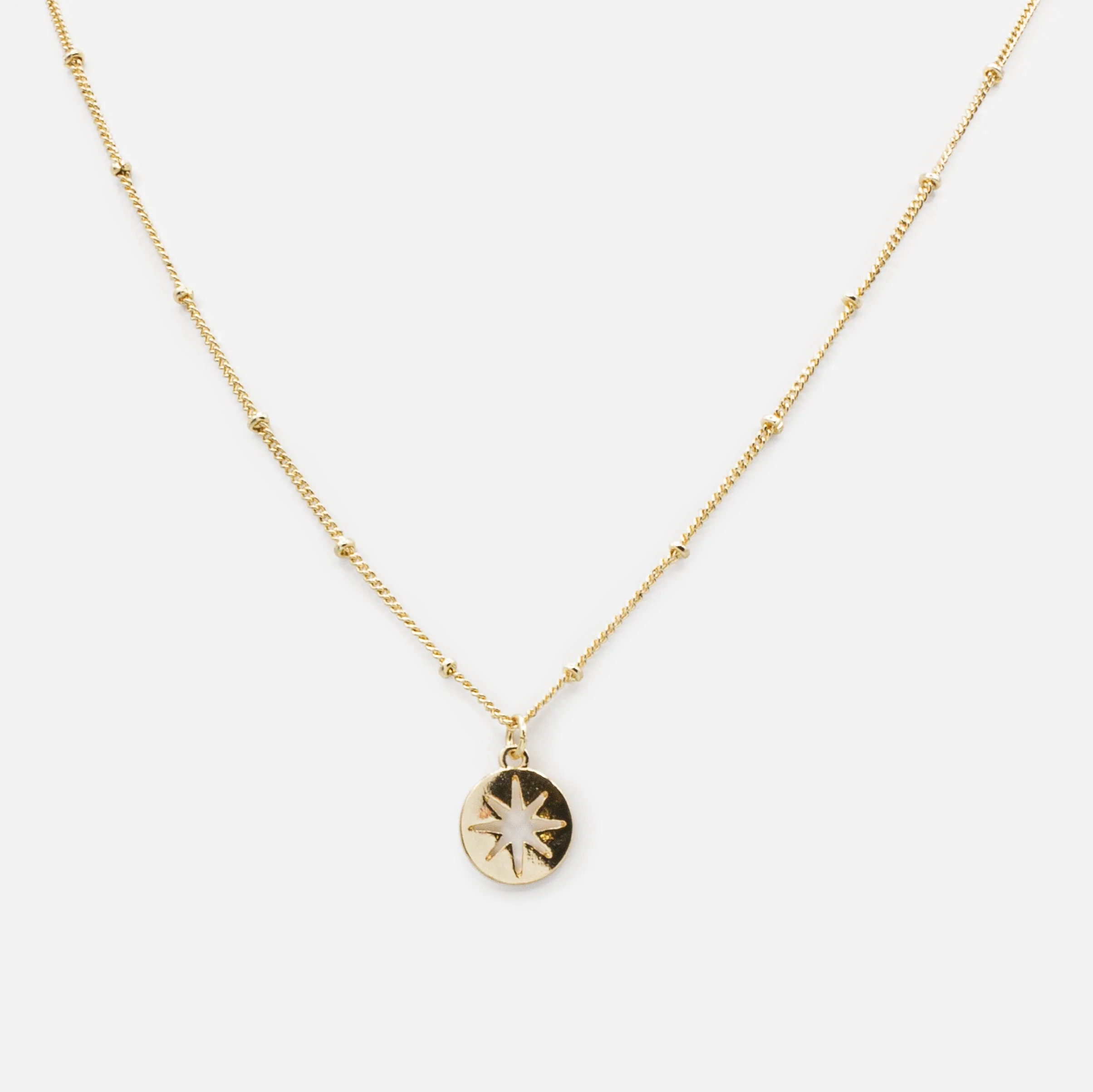 Collier doré breloque étoile vide