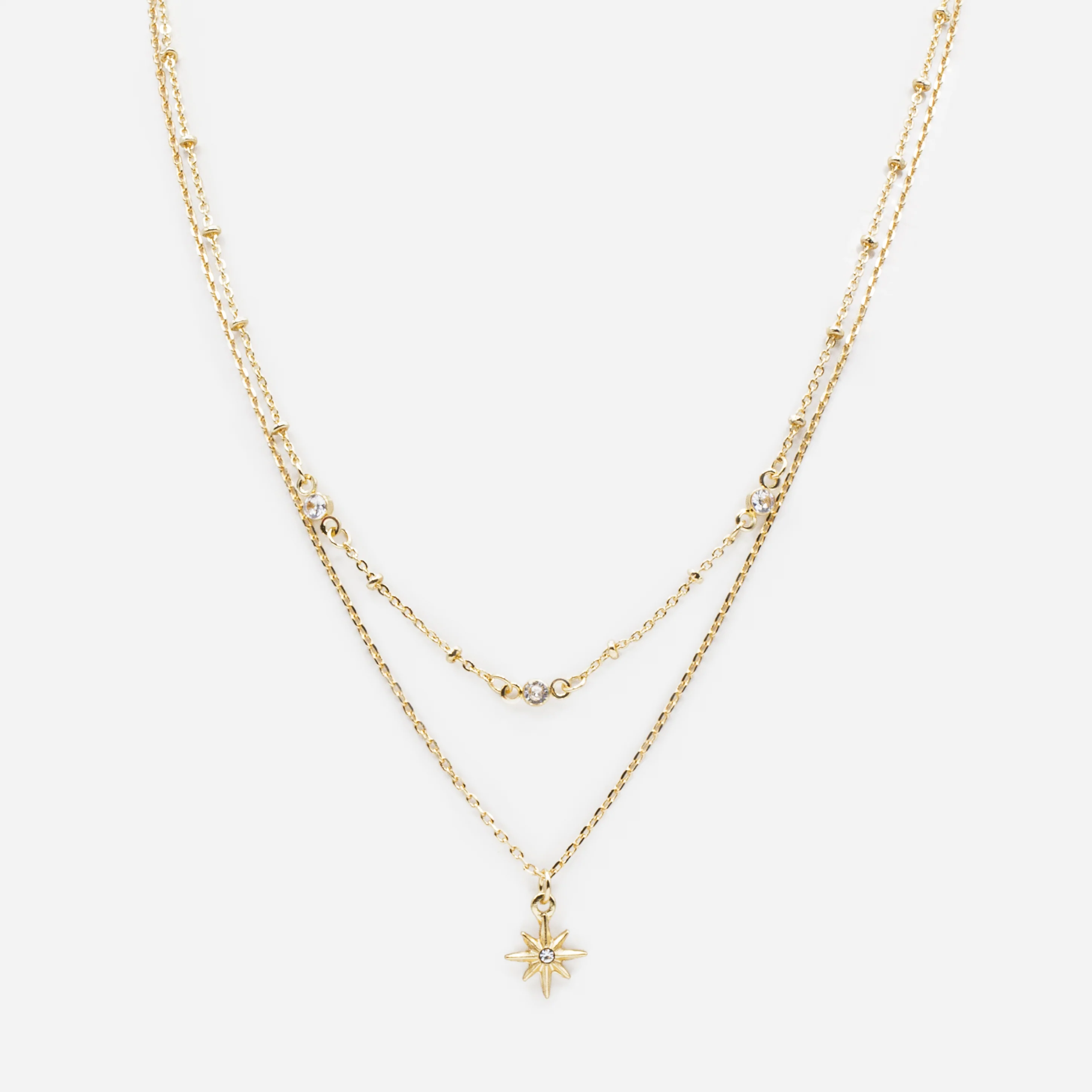 Ensemble de deux colliers dorés étoile et zircons cubiques