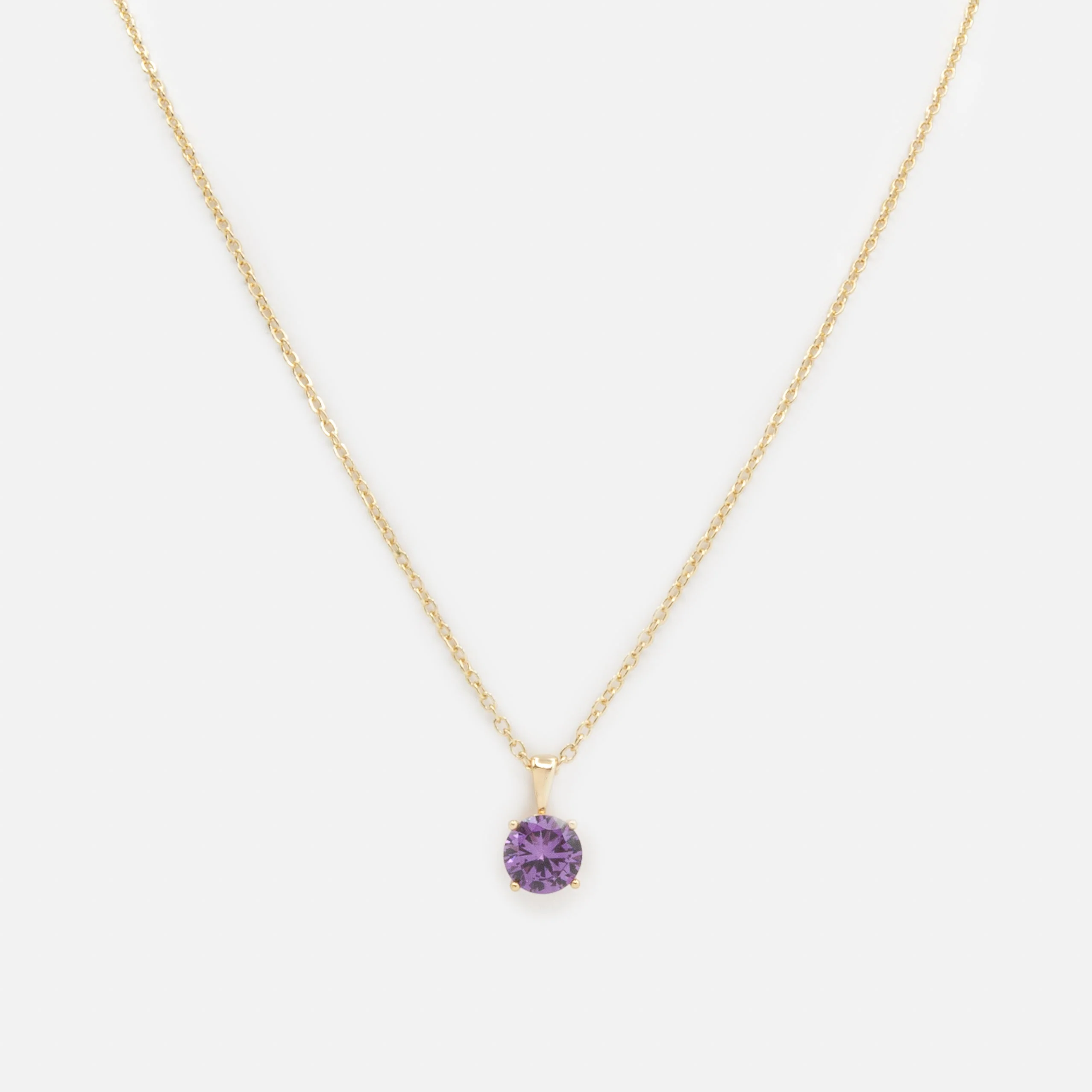 Collier doré breloque pierre mauve