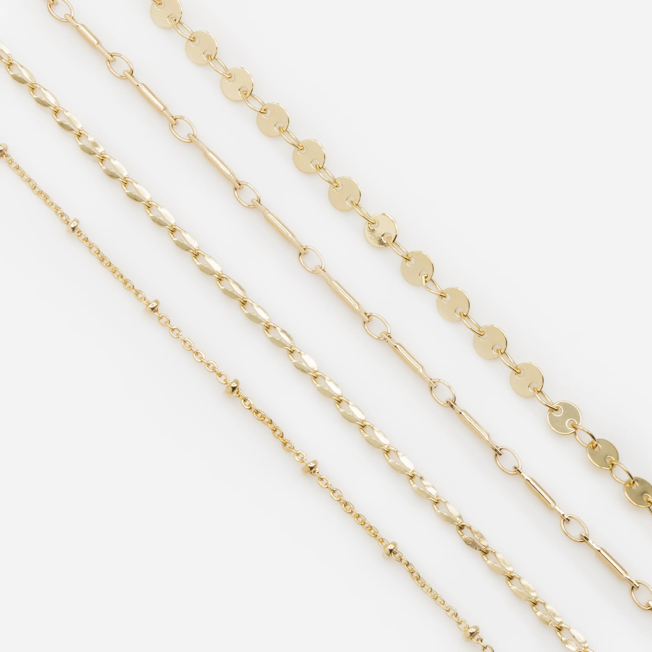 Ensemble de quatre bracelets dorés avec mailles originales - Image 6