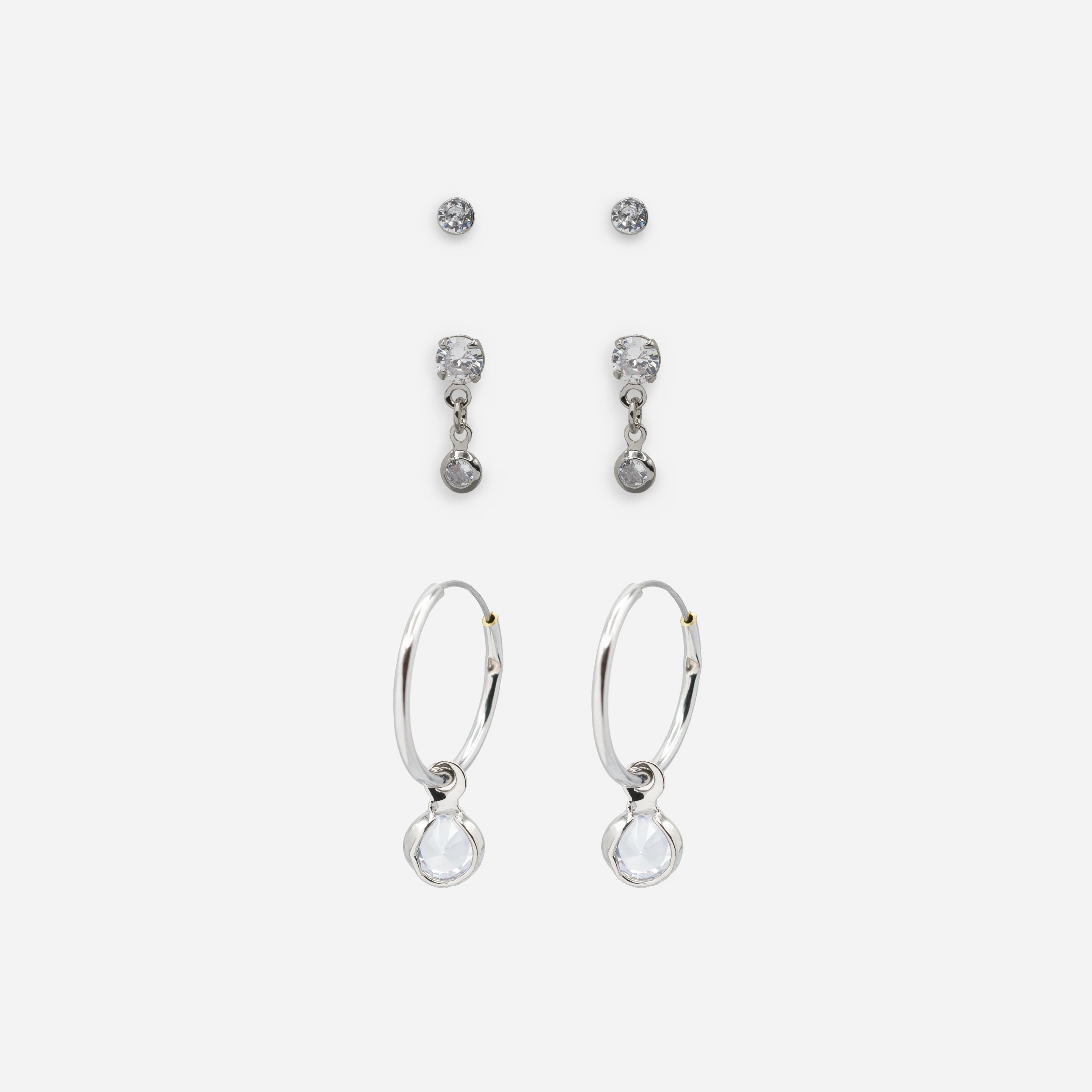 Trio de boucles d'oreilles argentées avec zircons cubiques